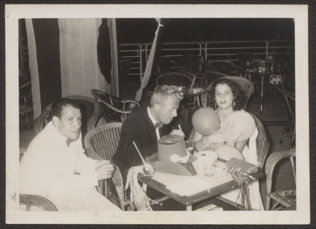 Photograph of Ahmed Yacoubi, Paul Bowles, and unidentified party guest, circa 1960 Photograph of Ahmed Yacoubi, Paul Bowles, and unidentified party guest, circa 1960