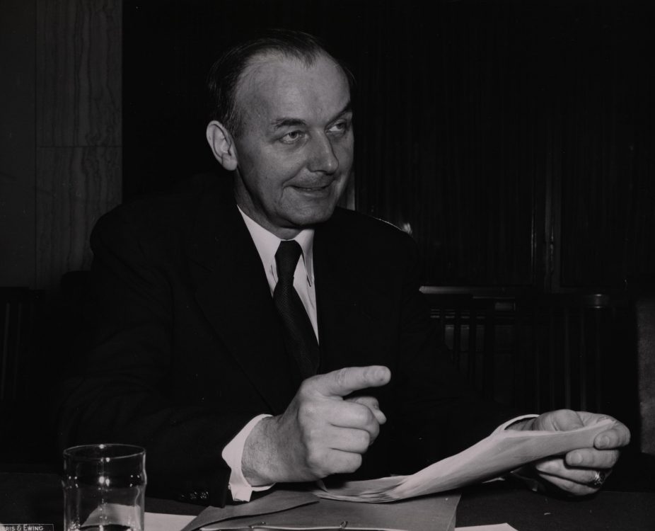 Photograph of Senator John Williams, reading and pointing, date unknown