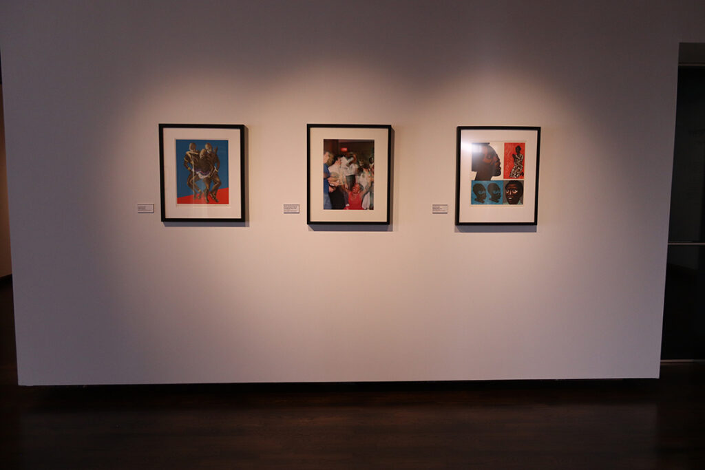 View of three artworks on wall.