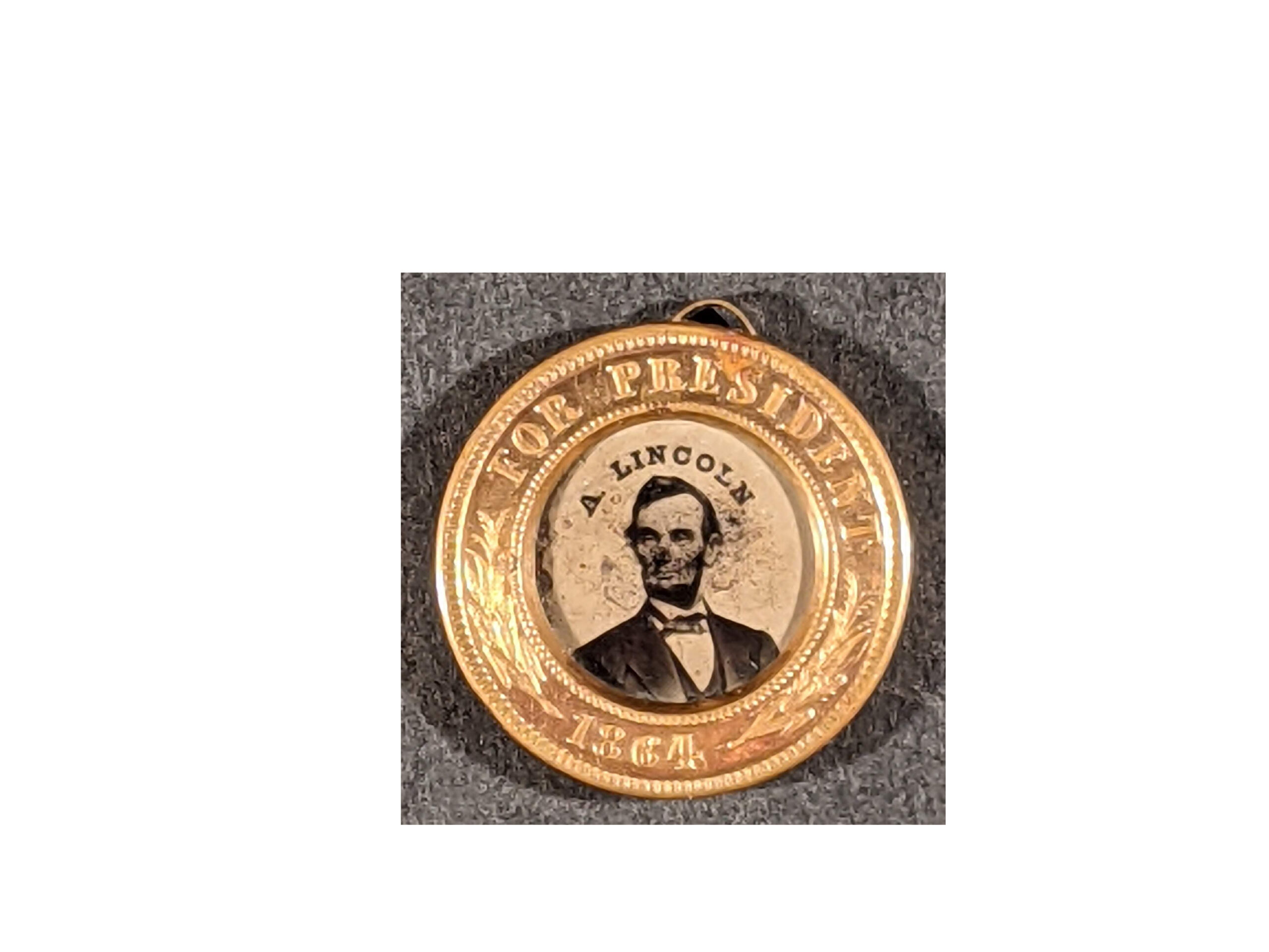 Abraham Lincoln / Andrew Johnson ferrotype button, Lincoln face (recto), 1864