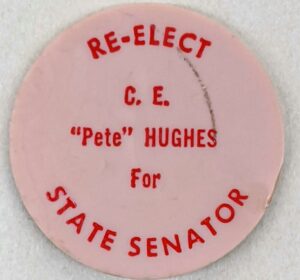 Creator unknown, “Re-elect C.E. “Pete” Hughes for State Senate” plastic token, circa 1970s, from the Jerome O. Herlihy political campaign ephemera collection